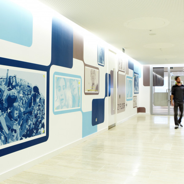 Staff walking by Environmental graphics