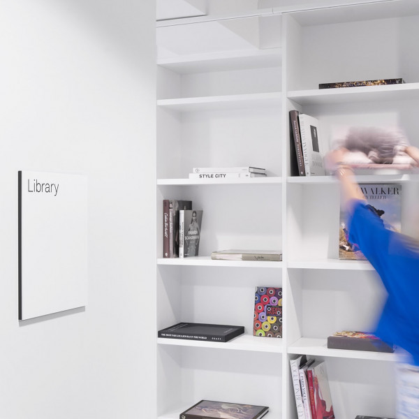 Visual identity - student taking the book from shelve