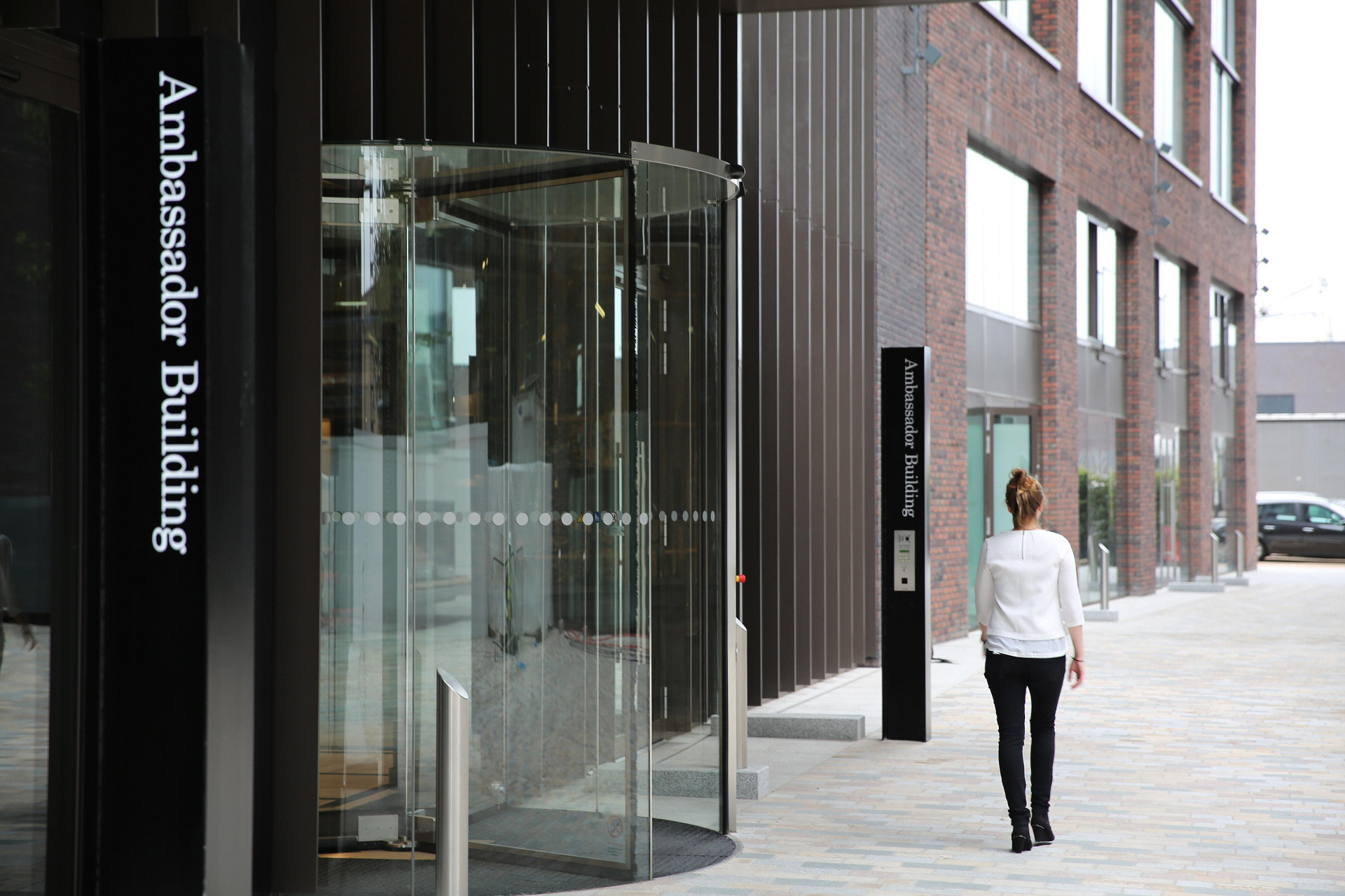 Endpoint's distinctive wayfinding design - resident walking at embassy gardens