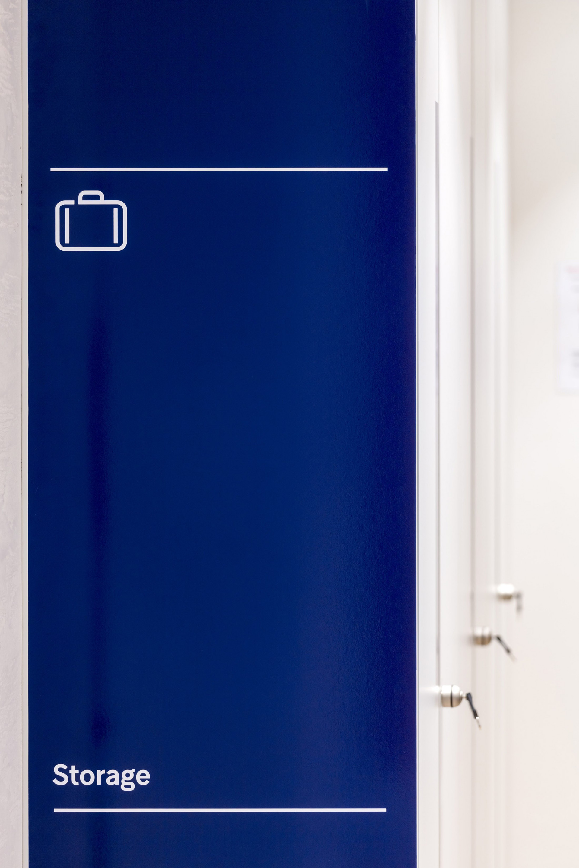 Corporate signage design - pictogram on lockers at Hikma's office