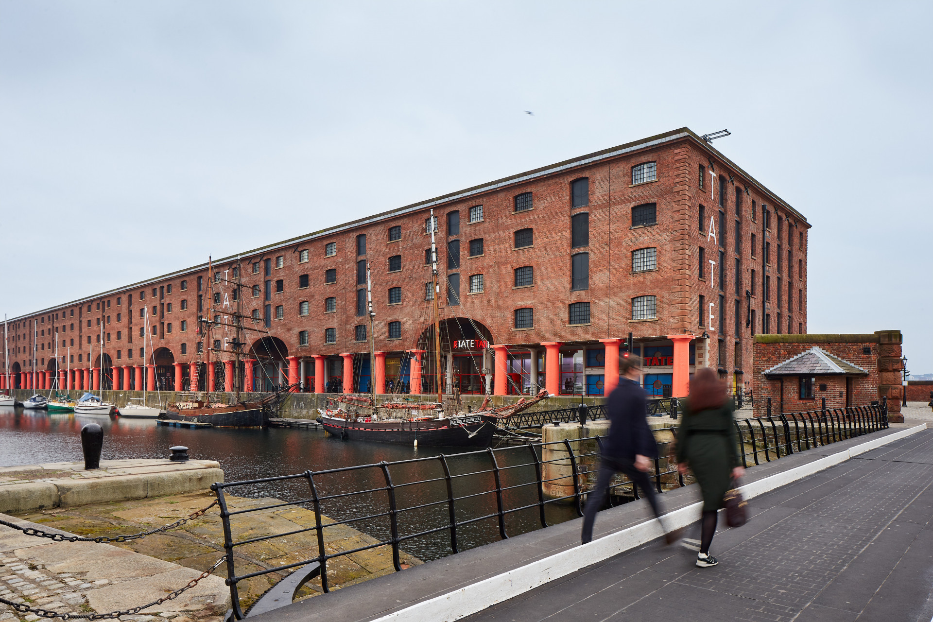 People crossing the bridge in Liverpool